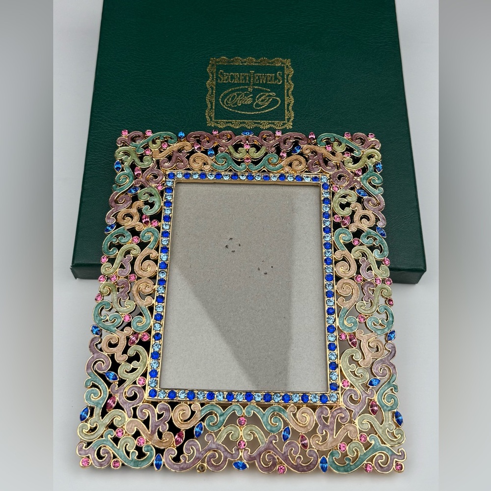 Secret Jewels by Rita G ornate frame. 
New in  box. Measures 5” (W) X 6” (L).